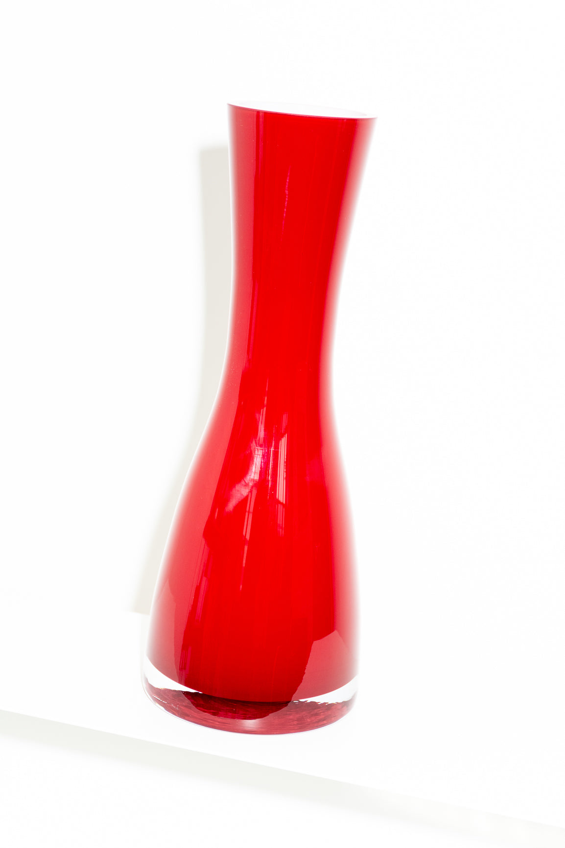 Red and white cased glass vase