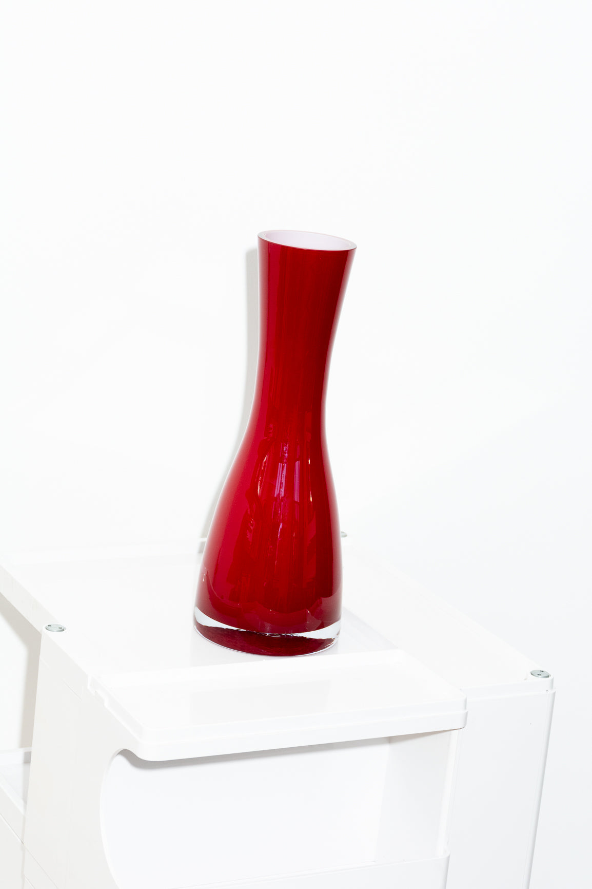 Red and white cased glass vase